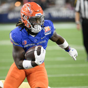 Dec 16, 2023; Inglewood, CA, USA; Boise State Broncos running back Ashton Jeanty (2) slips a tackle by UCLA Bruins linebacker Darius Muasau (53) during the first quarter of the Starco Brands LA Bowl at SoFi Stadium. Mandatory Credit: Robert Hanashiro-USA TODAY Sports