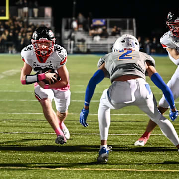 Muskego fullback Bryson Hoeffler (38) finds a hole in the against Mukwonago defense to score a touchdown during the first quarter in a game Friday, October 17, 2025, at Mukwonago High School in Mukwonago, Wisconsin.