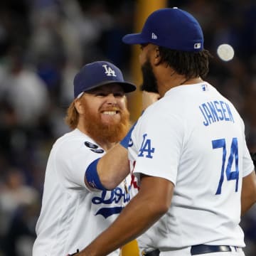 Oct 19, 2021; Los Angeles, California, USA; Los Angeles Dodgers first baseman Cody Bellinger (35), third baseman Justin Turner (10) and relief pitcher Kenley Jansen (74) celebrate after defeating the Atlanta Braves in game three of the 2021 NLCS at Dodger Stadium. The Dodgers won 6-5. Mandatory Credit: Kirby Lee-USA TODAY Sports