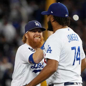 Oct 19, 2021; Los Angeles, California, USA; Los Angeles Dodgers first baseman Cody Bellinger (35), third baseman Justin Turner (10) and relief pitcher Kenley Jansen (74) celebrate after defeating the Atlanta Braves in game three of the 2021 NLCS at Dodger Stadium. The Dodgers won 6-5. Mandatory Credit: Kirby Lee-Imagn Images