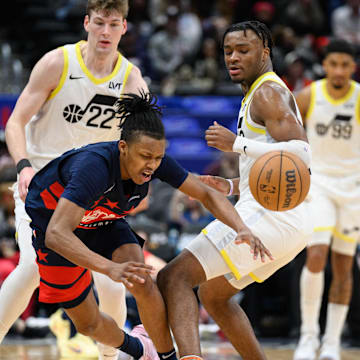 Mar 5, 2025; Washington, District of Columbia, USA; Washington Wizards guard Bub Carrington (8) is fouled by Utah Jazz guard Isaiah Collier (13) during the fourth quarter at Capital One Arena. Mandatory Credit: Reggie Hildred-Imagn Images