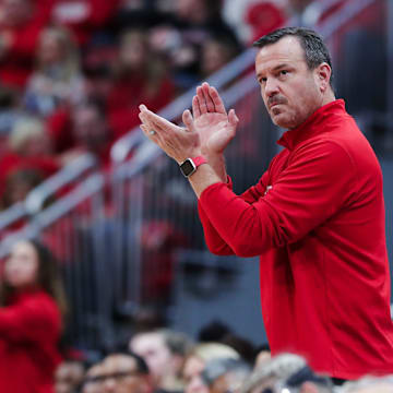 U of L head coach Jeff Walz applauded his team's play against UK during their game at the Yum Center in Louisville, Ky. on Dec. 10, 2023.