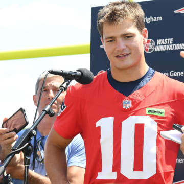 Jul 26, 2024; Foxborough, MA, USA; New England Patriots quarterback Drake Maye (10) holds a press conference at training camp at Gillette Stadium. Mandatory Credit: Eric Canha-USA TODAY Sports