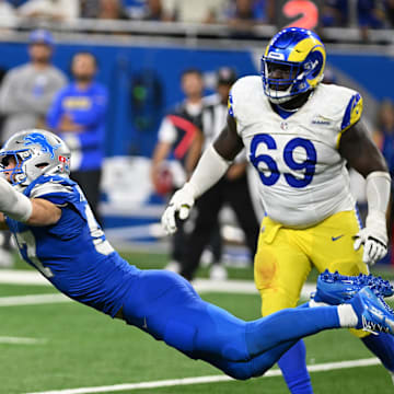 Sep 8, 2024; Detroit, Michigan, USA; Detroit Lions defensive end Aidan Hutchinson (97) sacks Los Angeles Rams quarterback Matthew Stafford (9) on the last play in regulation to send their game into overtime at Ford Field. Mandatory Credit: Lon Horwedel-Imagn Images