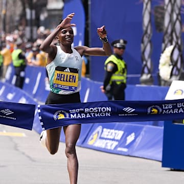 Hellen Obiri of Kenya crosses the finish line to win the women's division at the 2024 Boston Marathon.