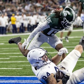 Nov 24, 2023; Detroit, Michigan, USA; Penn State Nittany Lions tight end Theo Johnson (84) scores a touchdown against the Michigan State Spartans during the second half at Ford Field. Mandatory Credit: David Reginek-Imagn Images