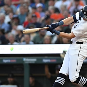 Sep 11, 2024; Detroit, Michigan, USA; Detroit Tigers shortstop Trey Sweeney (27) hits a home run against the Colorado Rockies in the first inning at Comerica Park. 