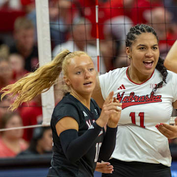 Nebraska DS/Libero Olivia Mauch, outside hitter Teraya Sigler, and setter Bergen Reilly celebrate a point during the Red-White Scrimmage on Saturday.