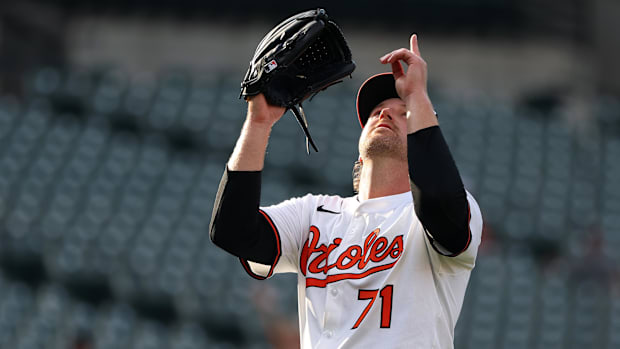 Baltimore Orioles pitcher Dietrich Enns celebrates after a game.