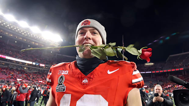 Ohio State Buckeyes quarterback Will Howard (18) celebrates the win