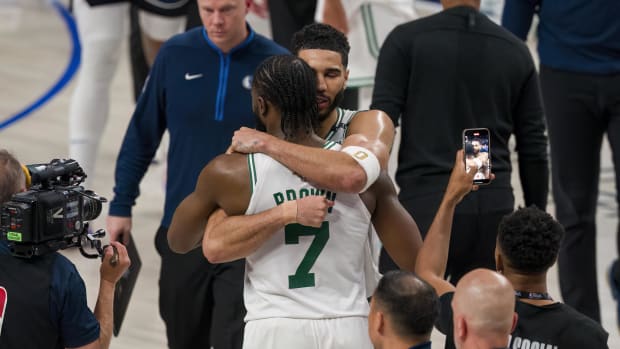 Jayson Tatum (0) hugs Jaylen Brown (7) after the Boston Celtics' Game 3 win over the Dallas Mavericks in the 2024 NBA Finals.