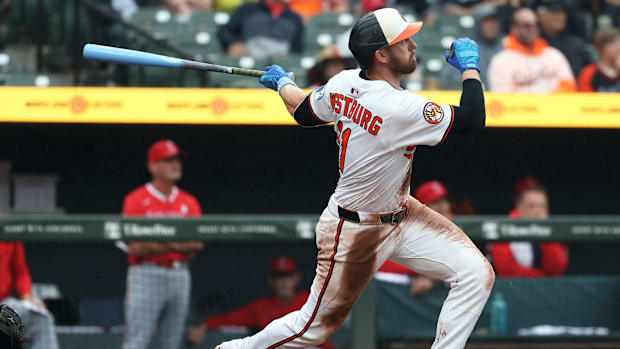 Baltimore Orioles third baseman Jordan Westburg swinging a bat in a white uniform.