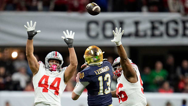 Notre Dame QB Riley Leonard throws against Ohio State in the national championship gam