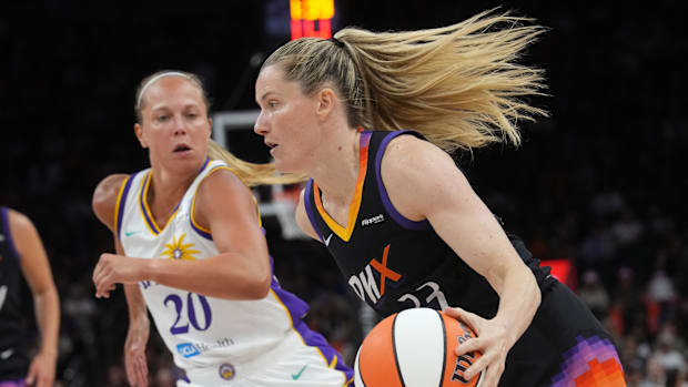 Phoenix Mercury guard Sami Whitcomb (33) drives past Julie Allemand of the Los Angeles Sparks.