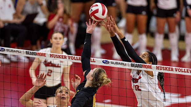 Nebraska volleyball's Taylor Landfair jousts at the net against Wichita State.
