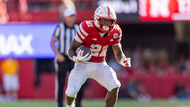 Nebraska running back Emmett Johnson gains five yards against Michigan.