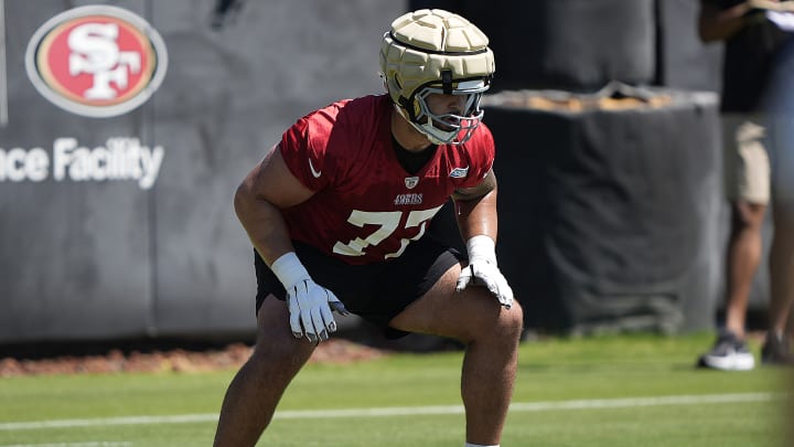 San Francisco 49ers offensive lineman Dominick Puni (77)