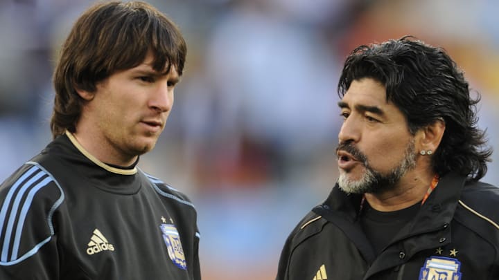Argentina's coach Diego Maradona (R) spe Argentina's coach Diego Maradona (R) spe
