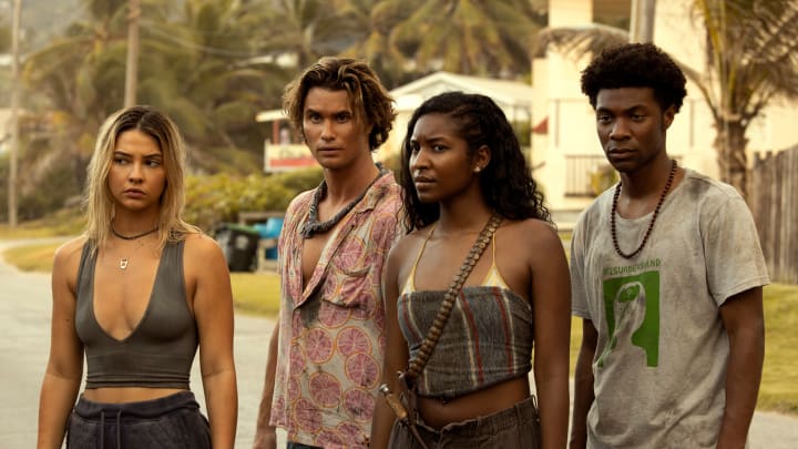 Outer Banks. (L to R) Madelyn Cline as Sarah Cameron, Chase Stokes as John B, Carlacia Grant as Cleo, Jonathan Daviss as Pope in episode 301 of Outer Banks. Cr. Jackson Lee Davis/Netflix © 2023