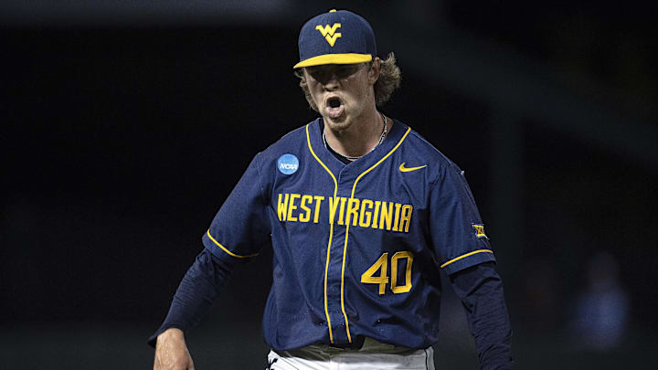 Jun 8, 2024; Chapel Hill, NC, USA; West Virginia Mountaineers pitcher Carson Estridge (40) reacts to getting an out against the North Carolina Tar Heels in the eighth inning of the DI Baseball Super Regional at Boshamer Stadium. Mandatory Credit: Jeffrey Camarati-Imagn Images
