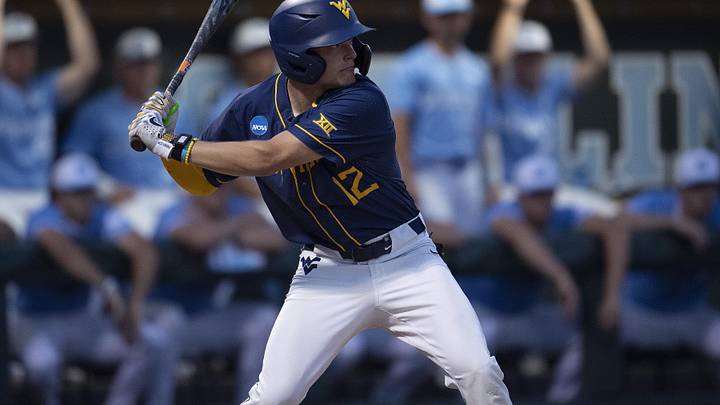 Jun 8, 2024; Chapel Hill, NC, USA; West Virginia Mountaineers Blaine Traxel (12) bats against the North Carolina Tar Heels in the second inning of the DI Baseball Super Regional at Boshamer Stadium. Mandatory Credit: Jeffrey Camarati-Imagn Images

