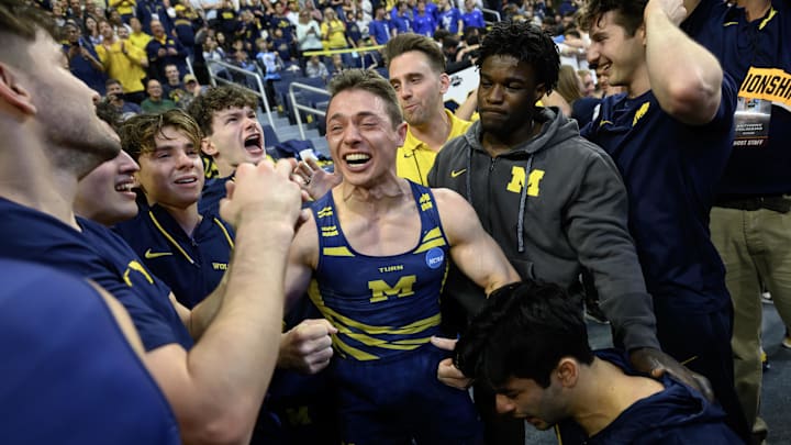 Apr 19, 2025; Ann Arbor, MI, USA;  Michigan gymnast  Paul Juda celebrates with his teammates after they won the NCAA Men’s Gymnastics National Championship at Crisler Center. Mandatory Credit: Lon Horwedel-Imagn Images