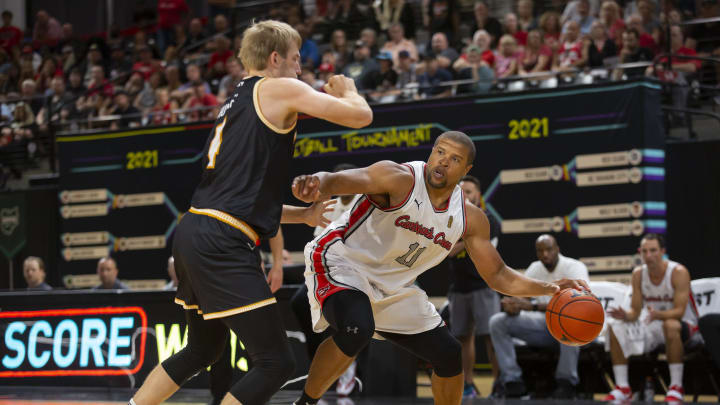 Carmen's Crew Jeff Gibbs (32) attempts to drive a lane against Men of Mackey's defending Robbie Hummel (4) during the second round of TBT against at the Covelli Center in Columbus, Ohio July 25. Carmen's Crew would go on to win the game 80-69.

Ceb Carmens Crew 0727 007