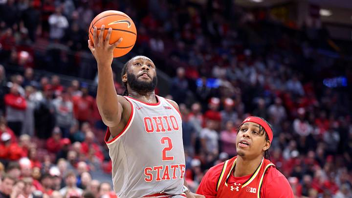 Feb 6, 2025; Columbus, Ohio, USA;  Ohio State Buckeyes guard Bruce Thornton (2) drives for a basket against Maryland Terrapins guard DeShawn Harris-Smith (5) during the second half at Value City Arena. Mandatory Credit: Joseph Maiorana-Imagn Images