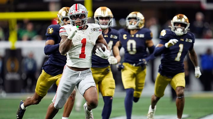 Ohio State Buckeyes running back Quinshon Judkins (1) gets away from the Notre Dame Fighting Irish defense on a long run in the third quarter during the College Football Playoff National Championship at Mercedes-Benz Stadium in Atlanta on January 20, 2025