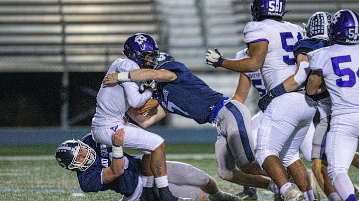 Cherry Hill West's Jordon DeJesus Gonzalez is sacked by Middletown South's Colin Gallagher and Luke Wafle during the first half of the Cherry Hill West vs. Middletown South NJSIAA Central Group 4 playoff football game at Middletown High School South in Middletown, NJ Friday, October 28, 2022.

Mid03