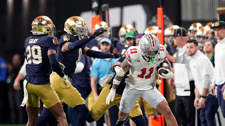Ohio State Buckeyes wide receiver Brandon Inniss (11) gets tackled after a catch against Notre Dame Fighting Irish in the second quarter during the College Football Playoff championship at Mercedes-Benz Stadium in Atlanta on January 20, 2025.