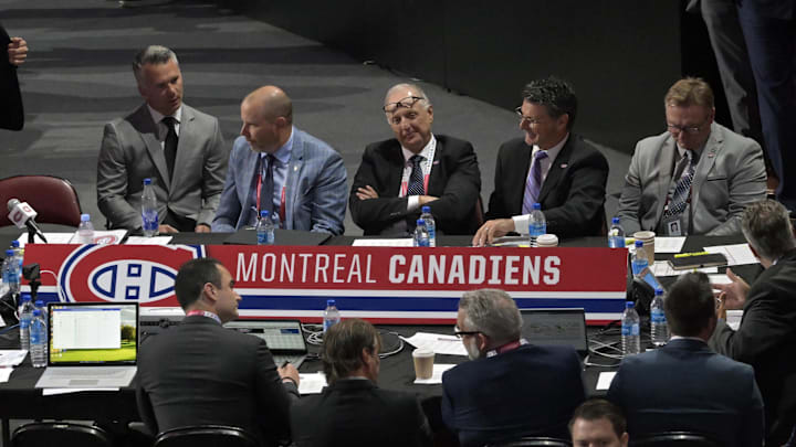 Jul 8, 2022; Montreal, Quebec, CANADA; General view of the Montreal Canadiens table during the second round of the 2022 NHL Draft at the Bell Centre. Montreal Canadiens head coach Martin St-Louis and General Manager Kent Hughes on the left. Mandatory Credit: Eric Bolte-Imagn Images