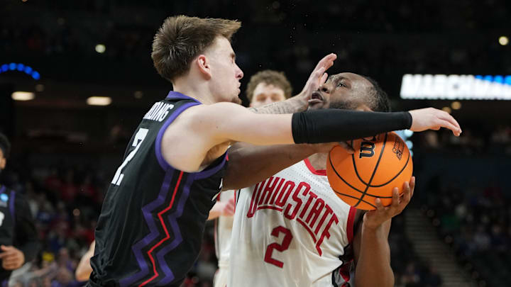  Ohio State Buckeyes guard Bruce Thornton (2) is fouled by Texas Christian University Horned Frogs guard Brock Harding (2) .