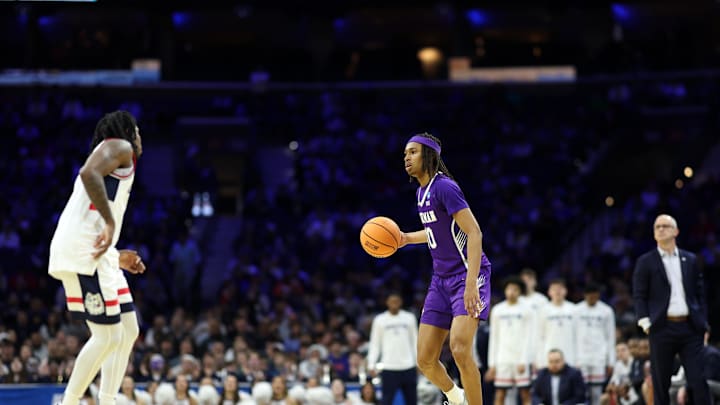 Mar 20, 2026; Philadelphia, PA, USA; Furman Paladins guard Alex Wilkins (10) dribbles the ball against the UConn Huskies in the second half during a first round game of the men's 2026 NCAA Tournament at Xfinity Mobile Arena. Mandatory Credit: Bill Streicher-Imagn Images