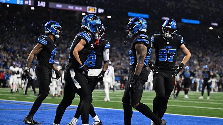 Jan 5, 2025; Detroit, Michigan, USA; Detroit Lions running back Jahmyr Gibbs (26) celebrates with wide receivers Amon-Ra St. Brown (14), Tim Patrick (17) and Jameson Williams (9) and tight end Sam LaPorta (87) in the end zone after running for a touchdown against the Minnesota Vikings in the first quarter at Ford Field. Mandatory Credit: Lon Horwedel-Imagn Images