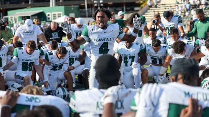 Aug 23, 2025; Honolulu, Hawaii, USA;  Hawaii Rainbow Warriors defensive back Elijah Palmer (4) leads the team in a prayer after they defeated the Stanford Cardinal during the second half at Clarence T.C. Ching Athletics Complex. Mandatory Credit: Marco Garcia-Imagn Images