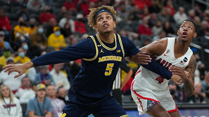 Nov 21, 2021; Las Vegas, Nevada, USA; Michigan Wolverines forward Terrance Williams II (5) blocks out Arizona Wildcats guard Dalen Terry (4) during a second half free throw attempt at T-Mobile Arena. Mandatory Credit: Stephen R. Sylvanie-Imagn Images