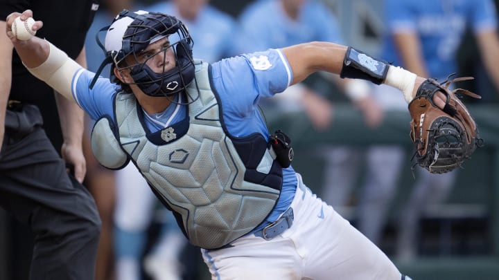 Jun 3, 2024; Chapel Hill, NC, USA; North Carolina Tar Heels Luke Stevenson (44) makes a throw back to the pitcher during the fifth inning of Div. I NCAA baseball regional against the Louisiana State Tigers at Boshamer Stadium.  Mandatory Credit: Jeffrey Camarati-USA TODAY Sports
