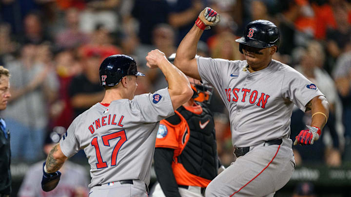 Aug 17, 2024; Baltimore, Maryland, USA; Boston Red Sox third baseman Rafael Devers (11) celebrates with outfielder Tyler O'Neill (17) after hitting a home run during the eighth inning against the Baltimore Orioles at Oriole Park at Camden Yards. Mandatory Credit: Reggie Hildred-Imagn Images