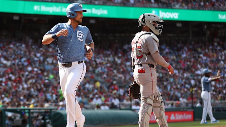 Jul 5, 2025; Washington, District of Columbia, USA; Washington Nationals first baseman Nathaniel Lowe (33) scores during the fourth inning against the Boston Red Sox at Nationals Park. Mandatory Credit: Daniel Kucin Jr.-Imagn Images