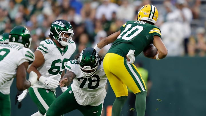 New York Jets defensive tackle Jay Tufele (78) sacks Green Bay Packers quarterback Jordan Love (10) during their football game Saturday, August 9, 2025, at Lambeau Field in Green Bay, Wisconsin.