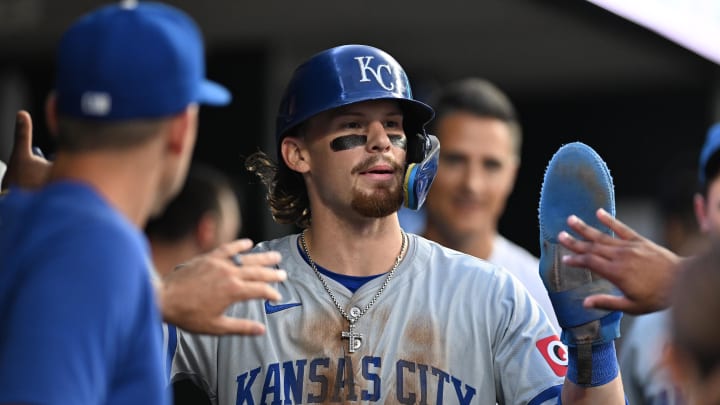 Aug 2, 2024; Detroit, Michigan, USA;  Kansas City Royals shortstop Bobby Witt Jr. (7) celebrates in the dugout after scoring on a wild pitch against the Detroit Tigers in the seventh inning at Comerica Park.  Mandatory Credit: Lon Horwedel-USA TODAY Sports