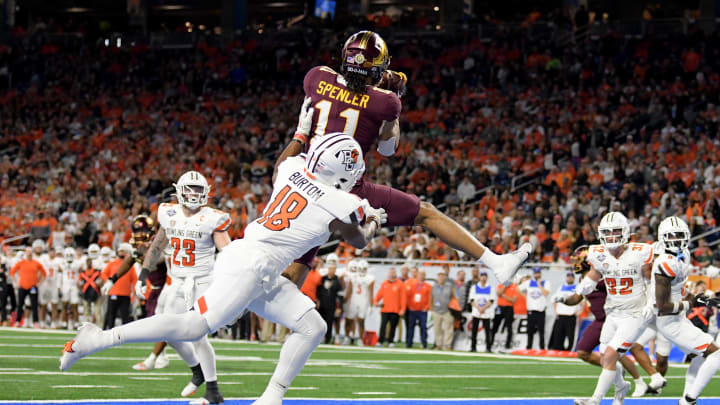 Dec 26, 2023; Detroit, MI, USA;  Minnesota Golden Gophers wide receiver Elijah Spencer (11) catches a touchdown pass in front of Bowling Green Falcons cornerback Jalen Burton (18) in the first quarter at Ford Field. Mandatory Credit: Lon Horwedel-USA TODAY Sports