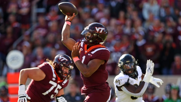 Oct 14, 2023; Blacksburg, Virginia, USA; Virginia Tech Hokies quarterback Kyron Drones (1) throws a pass during the first quarter against the Wake Forest Demon Deacons at Lane Stadium. Mandatory Credit: Peter Casey-USA TODAY Sports