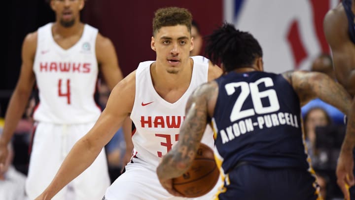 Jul 9, 2019; Las Vegas, NV, USA; Atlanta Hawks forward Reid Travis (32) defends against Indiana Pacers guard DeVaughn Akoon-Purcell (26) during the second half of an NBA Summer League game at Thomas & Mack Center. Mandatory Credit: Stephen R. Sylvanie-USA TODAY Sports