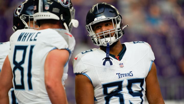 Tennessee Titans tight end Josh Whyle (81) and tight end Thomas Odukoya (89) talk during warm ups at U.S. Bank Stadium in Minneapolis, Minn., Saturday, Aug. 19, 2023.