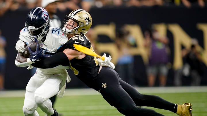 Tennessee Titans running back Tyjae Spears (32) is tackled by New Orleans Saints safety Tyrann Mathieu (32) in the first quarter at the Caesars Superdome in New Orleans, La., Sunday, Sept. 10, 2023.