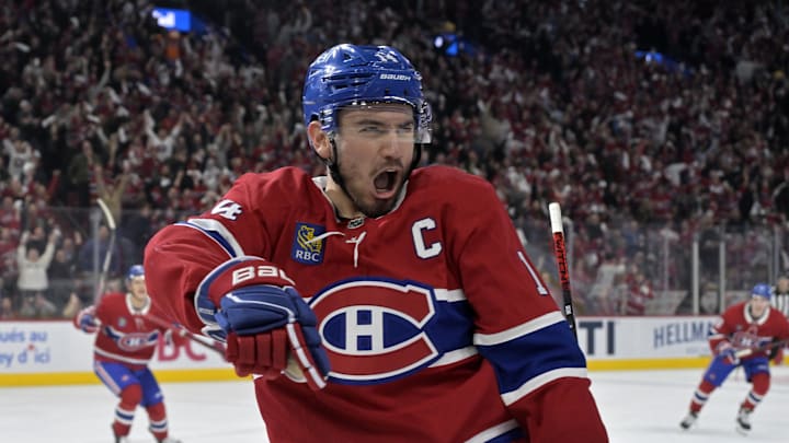 Apr 25, 2025; Montreal, Quebec, CAN; Montreal Canadiens forward Nick Suzuki (14) celebrates after scoring a goal against the Washington Capitals during the second period in game three of the first round of the 2025 Stanley Cup Playoffs at the Bell Centre. Mandatory Credit: Eric Bolte-Imagn Images