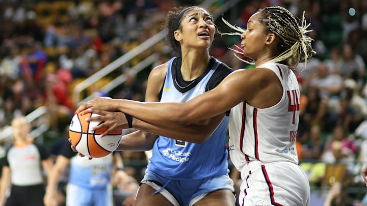 Jul 8, 2025; Fairfax, Virginia, USA; Chicago Sky forward Angel Reese (5) drives past Washington Mystics forward Kiki Iriafen (44) during the second half at EagleBank Arena. Jul 8, 2025; Fairfax, Virginia, USA; Chicago Sky forward Angel Reese (5) drives past Washington Mystics forward Kiki Iriafen (44) during the second half at EagleBank Arena.