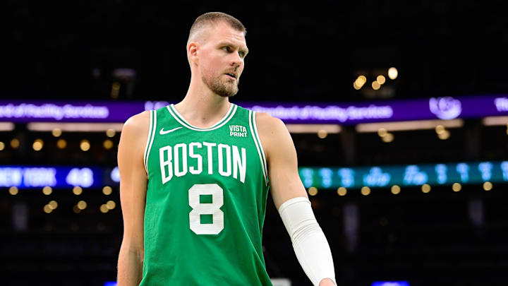 Dec 8, 2023; Boston, Massachusetts, USA;  Boston Celtics center Kristaps Porzingis (8) looks on during the first half against the New York Knicks at TD Garden. Mandatory Credit: Eric Canha-Imagn Images